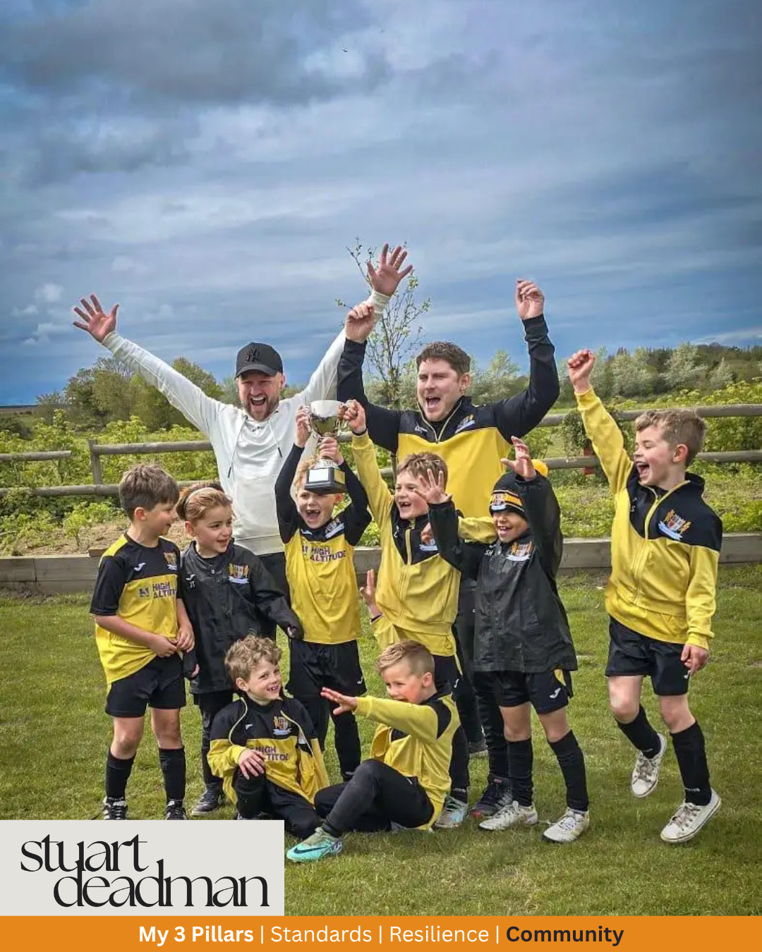 Stuart Deadman celebrating with the local football team he helps coach